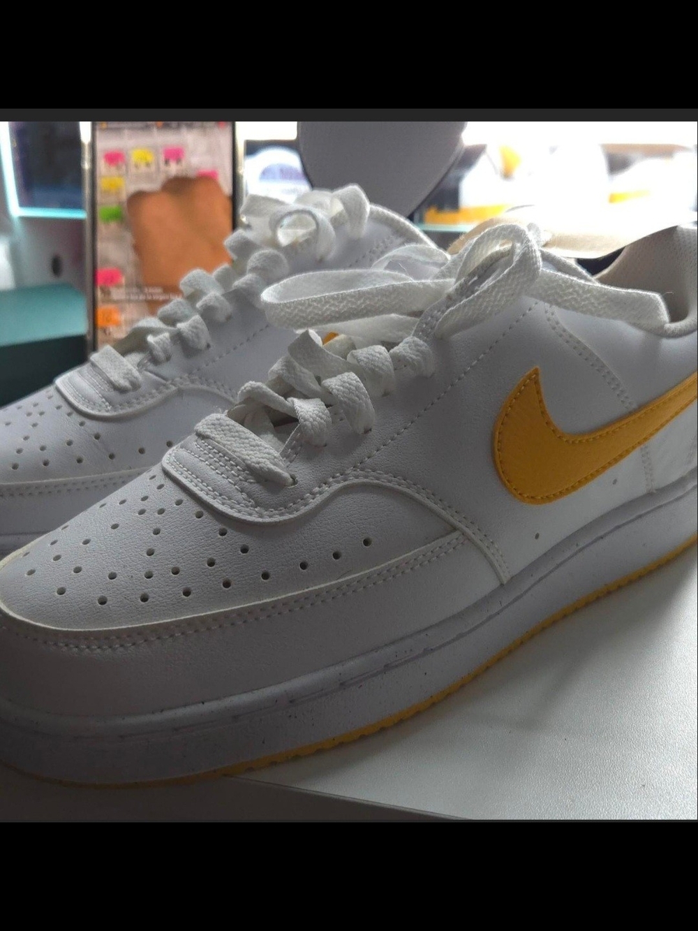 Nike White Sneakers with Yellow Swoosh Accent